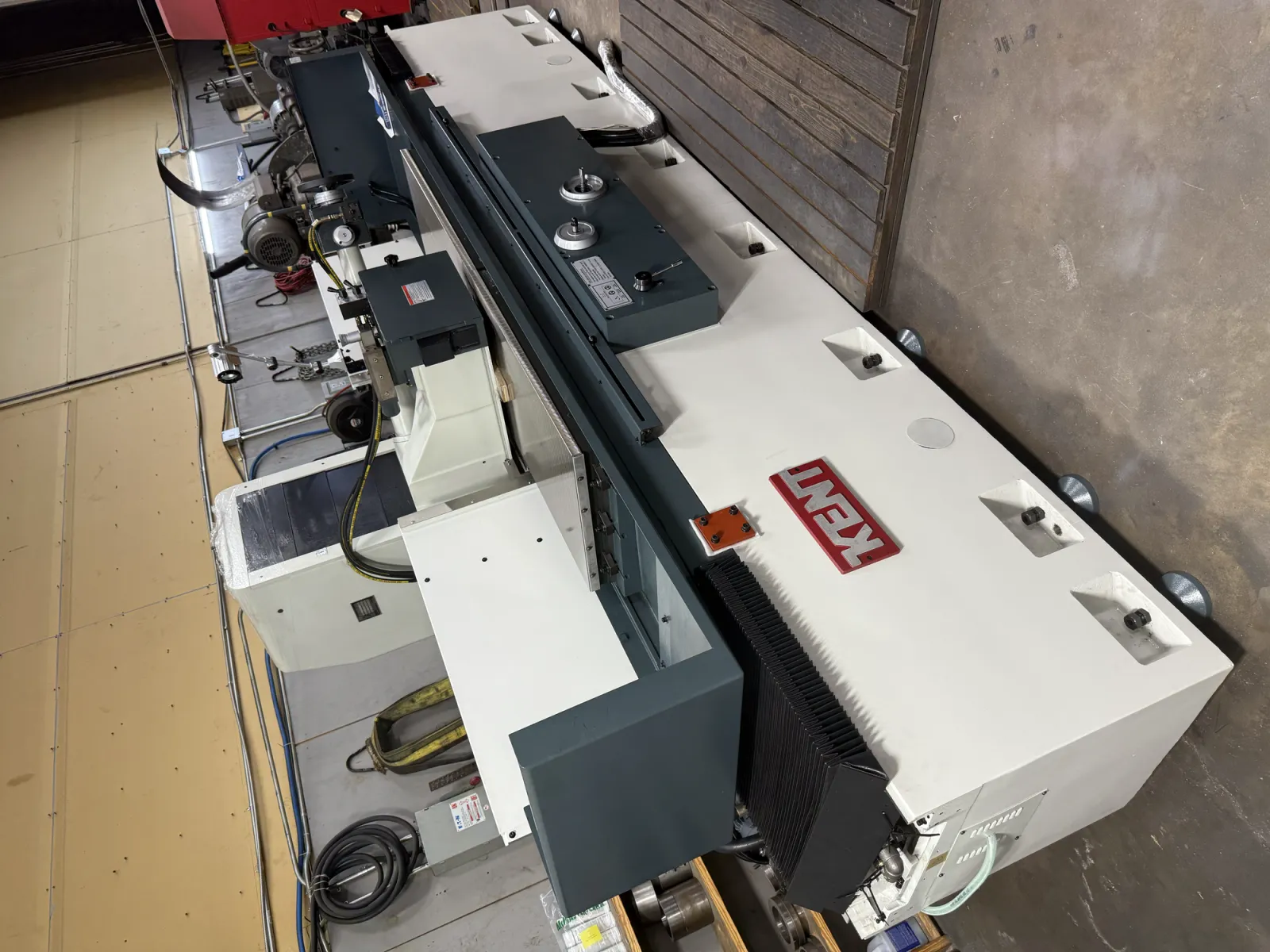 Overhead view along the length of the Kent KGS-620AHD surface grinder at Grindmasters